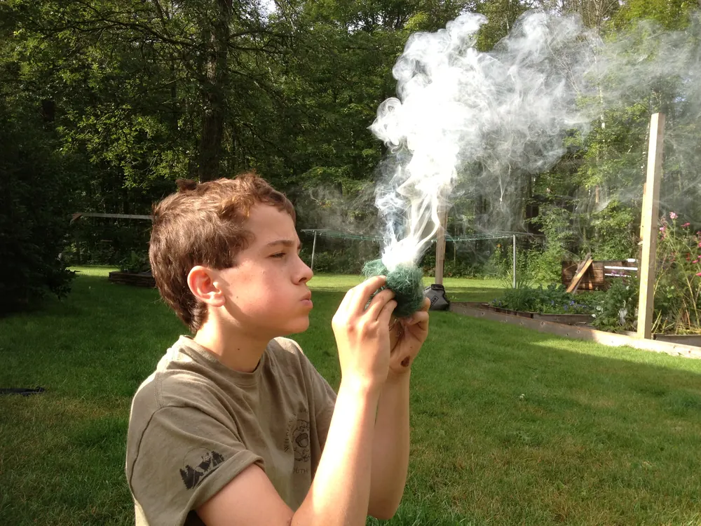 Tommy, Robert’s son, making fire outdoors